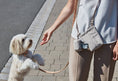 Load image into Gallery viewer, Water-repellent dog training treat bag in action

