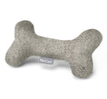 Load image into Gallery viewer, Puppy cuddling with soft wool Calma bone toy in subtle color
