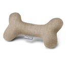 Teething puppy playing safely with Calma bone toy