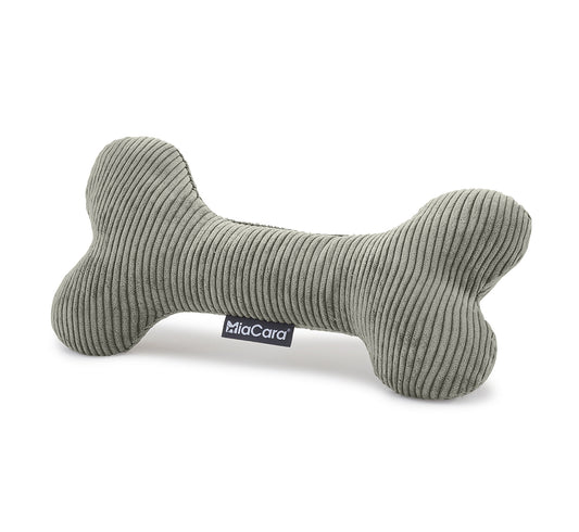 Dog happily chewing on a durable bone toy